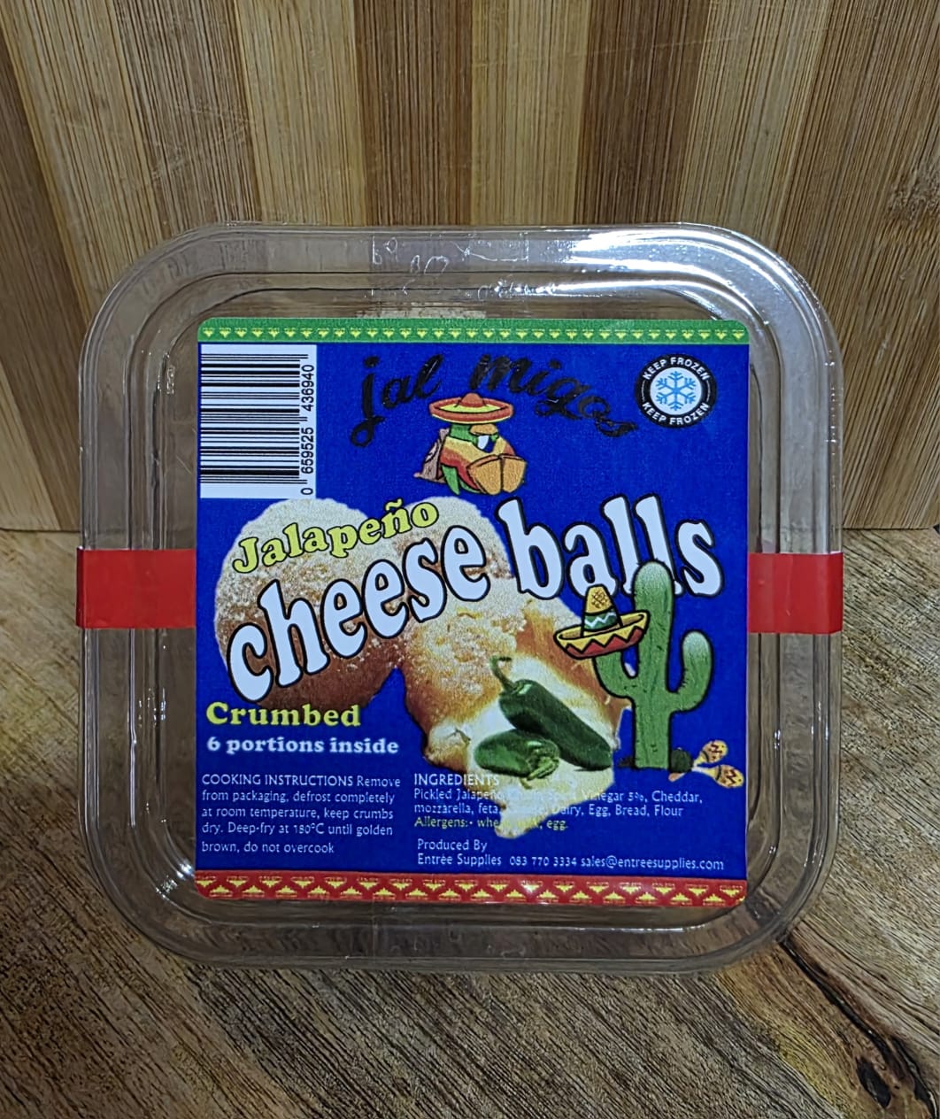 Tray of six crumbed Jalapeño Cheese Balls with a blue, green and yellow label
